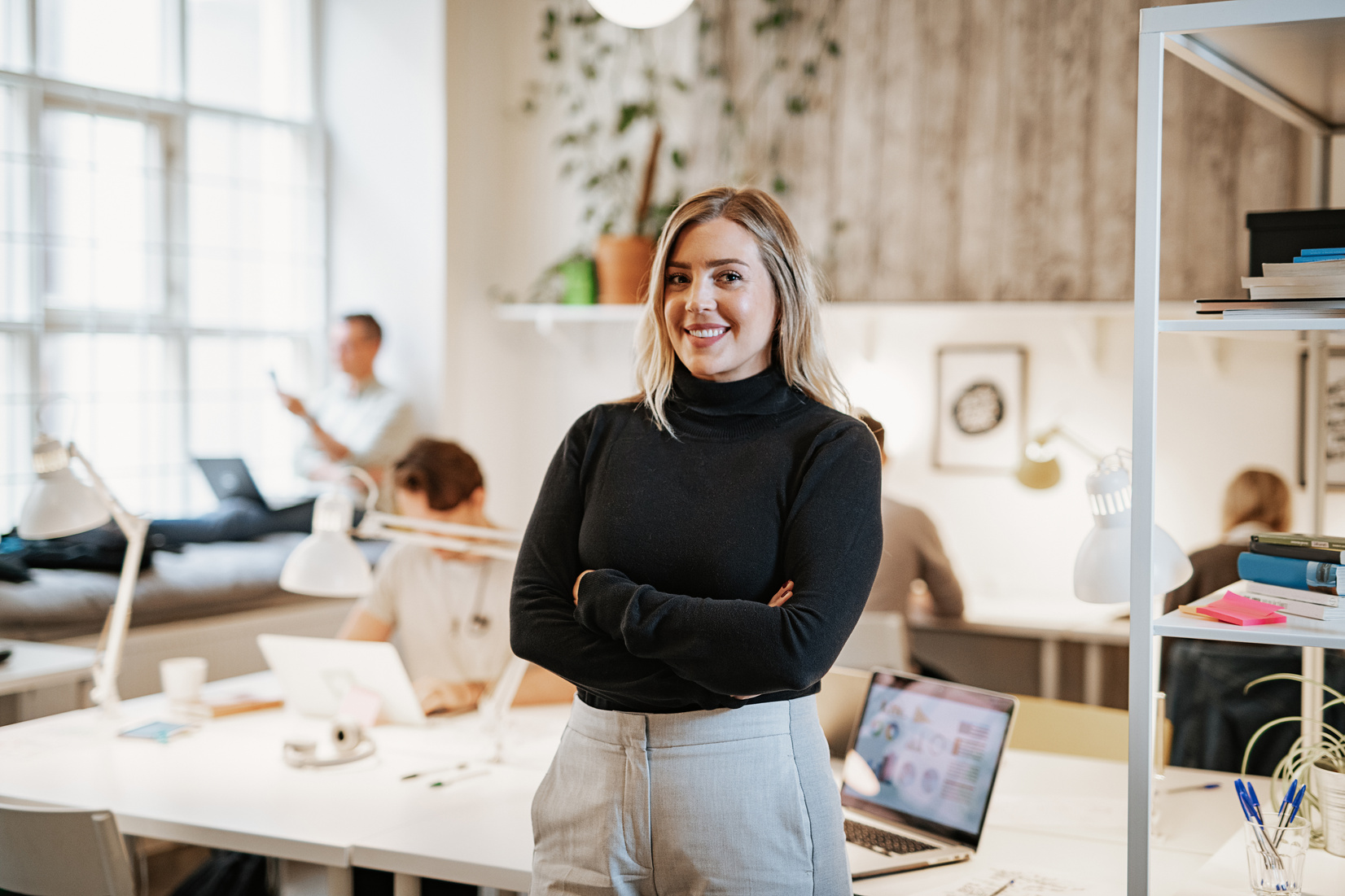 Successful female entrepreneur in co-working space